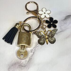 Louis Vuitton Vintage Lock & Key Set #228 with a Floral Butterfly Charm Keychain